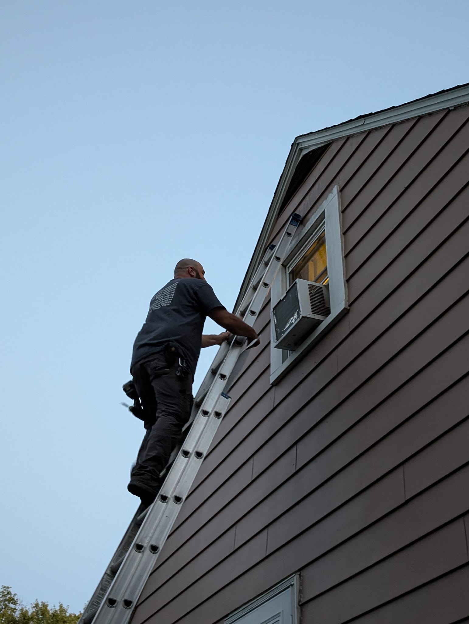 Home inspector examining a property exterior in Akron Ohio